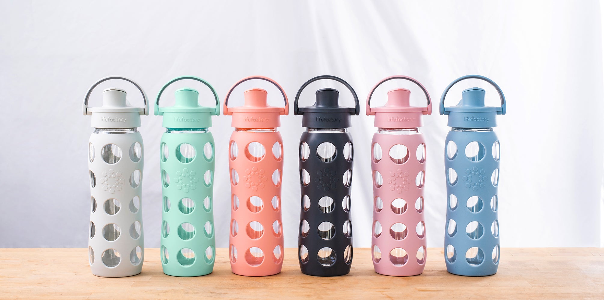 Lifefactory glass water bottles in assortment of colors. 